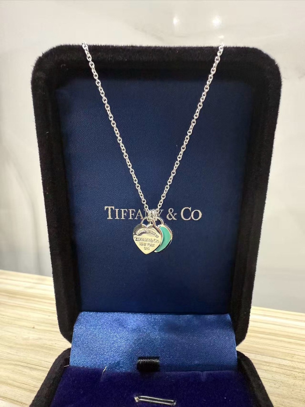 Tiffany  &   Co. . Silver Necklace with Blue-Green Enamel Heart Charms